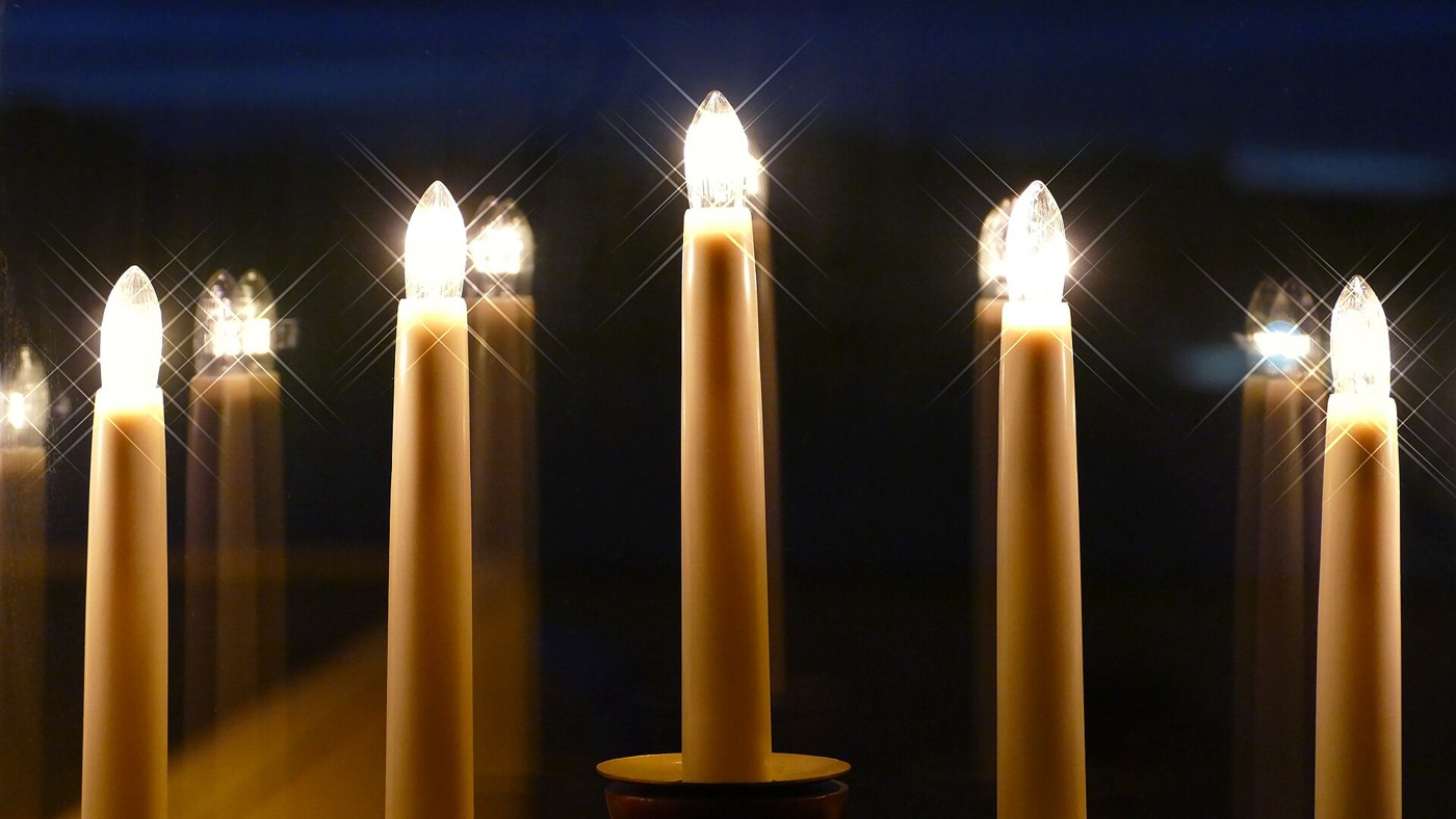 Electric candle lights photographed with a star-shaped light effect