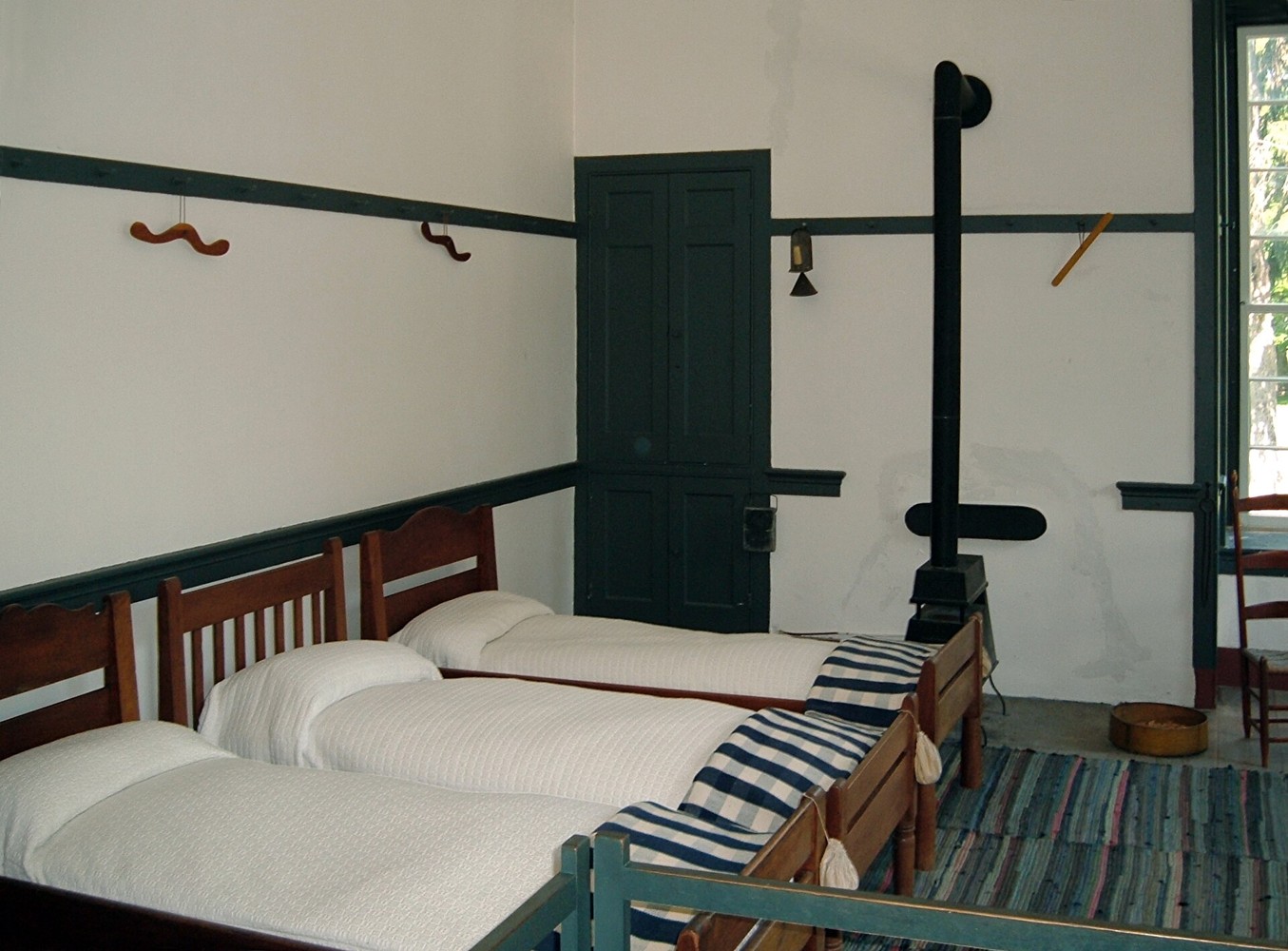 A bedroom in a historic Shaker setting