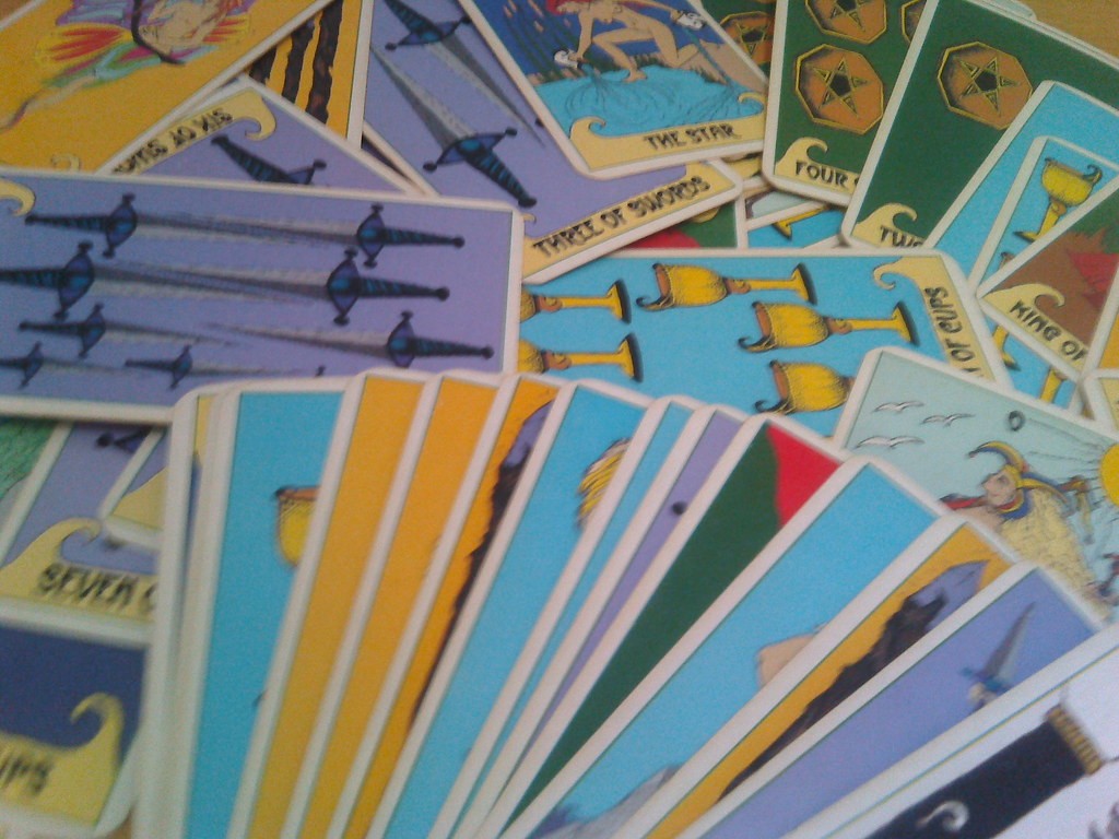 Tarot cards, oracle cards and runes photographed together