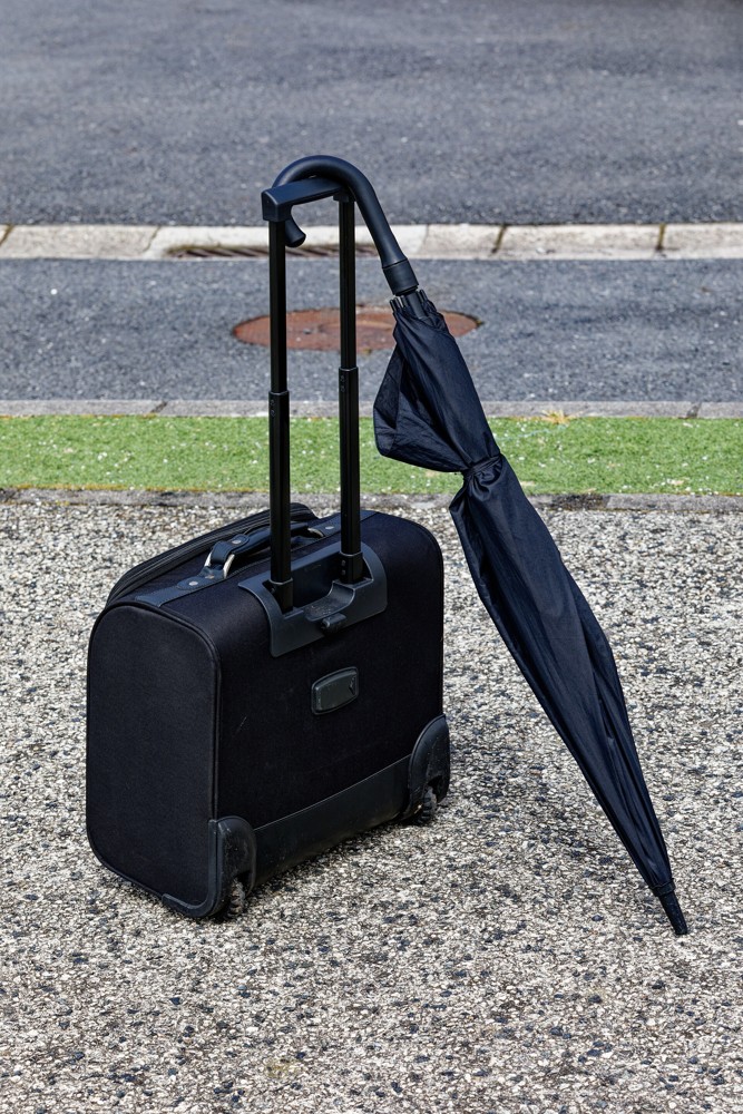 Travel map and suitcase prepared for a trip